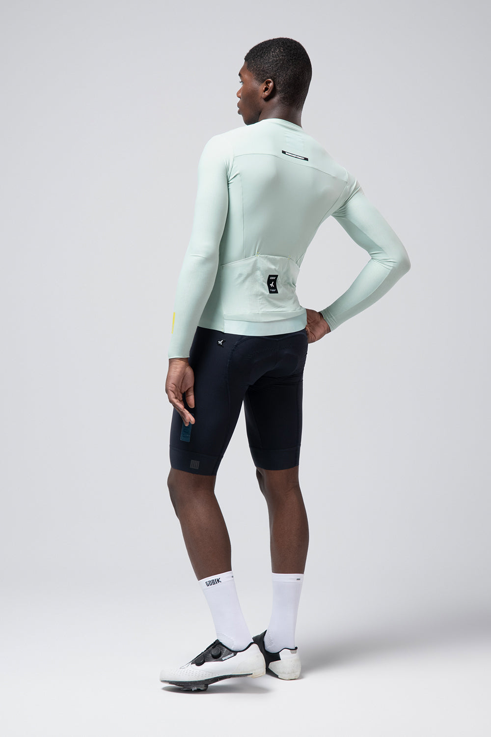 Gobik Avalon long sleeve cycling jersey in halcyon green, rear view on model