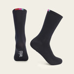 Black Velocio cycling socks with colorful striped cuff on clean studio background