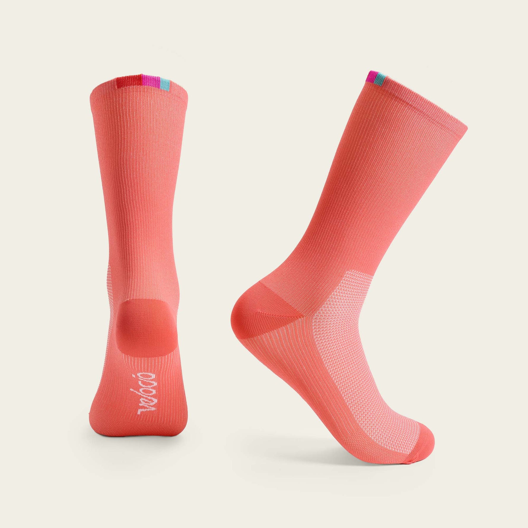 Velocio Terra cycling socks in coral pink with colorful cuff details