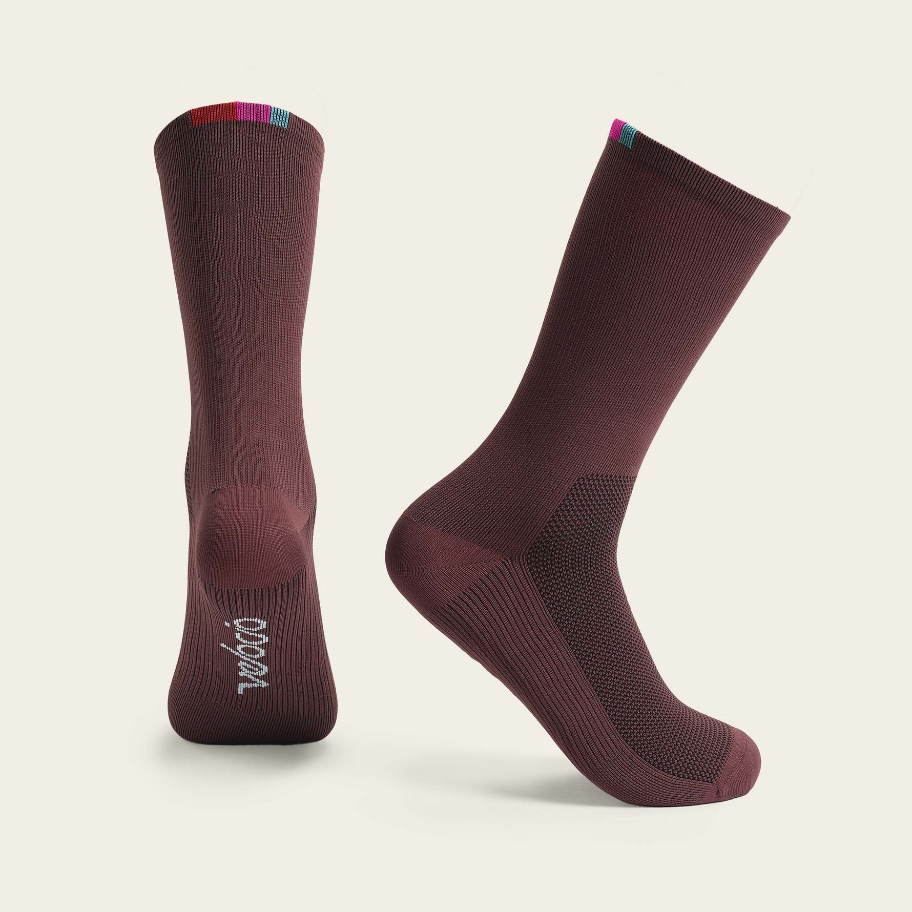 Velocio Terra cycling socks in burgundy with colorful cuff details, professional studio shot