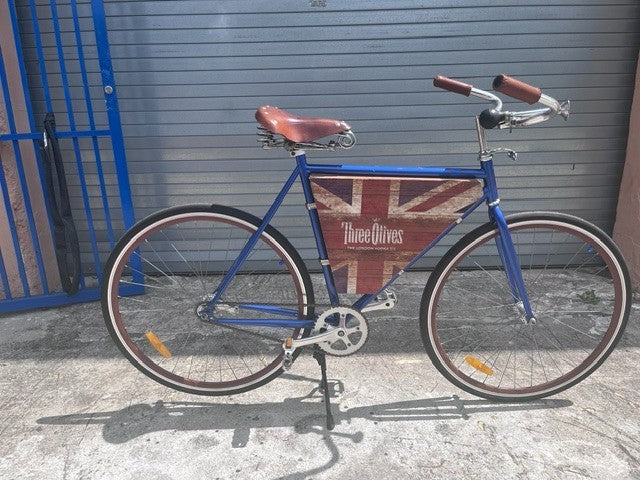 Custom Three Olives Vodka bar cruiser bike in metallic royal blue, full side view
