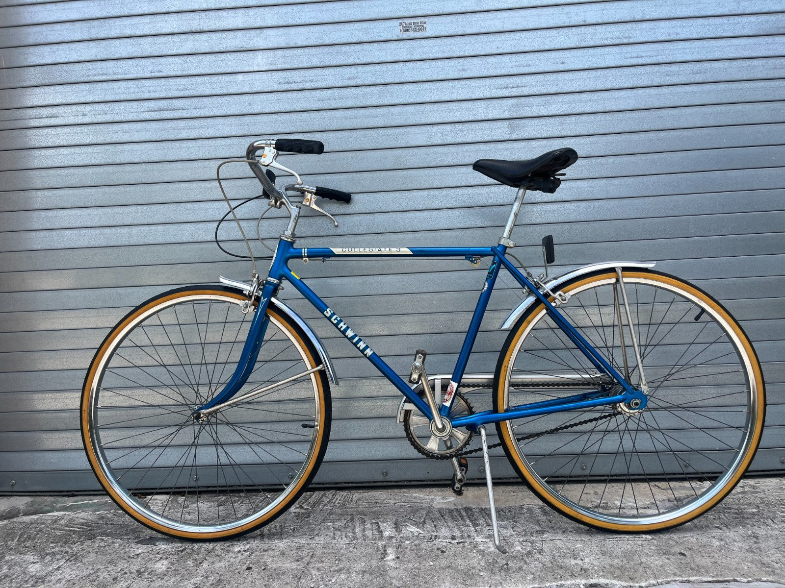 Blue steel frame and Schwinn Collegiate graphics on 1985 3-speed cruiser