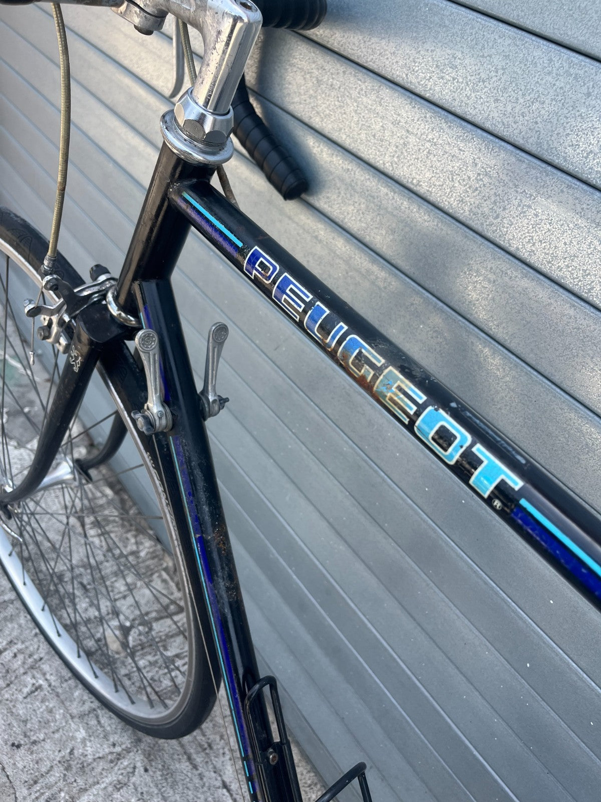 Vintage 1980s Peugeot 12-speed road bike, alternate view of black steel frame
