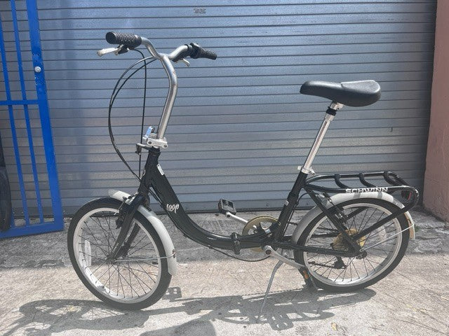 Schwinn Loop folding bike folded down, showing hinge and handlepost