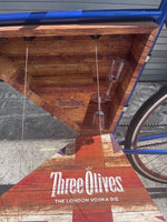 Three Olives Vodka branding and metallic blue paint detail on bar bike