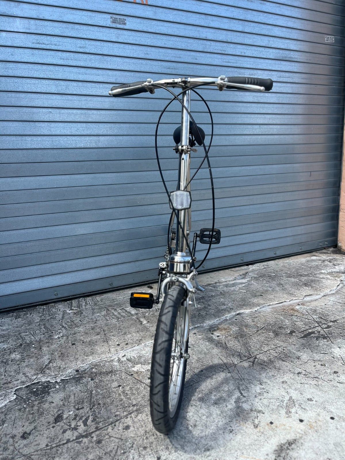 Original polished steel frame and hinge detail on 1988 Dahon Classic III