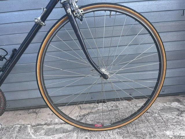 700C clincher wheel and side-pull caliper brake on vintage Trek 400 road bike