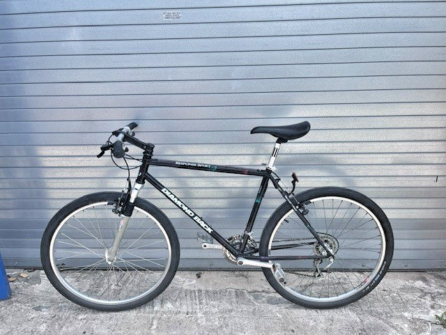Retro 90s purple splatter graphics on black Diamondback Response Sport steel frame