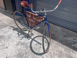 Centre kickstand, coaster brake wheel and cabinet interior on Three Olives bar bike