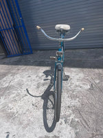 1960 J.C. Higgins Flightliner teal paint and coaster brake rear wheel detail