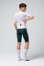 Gobik Attitude 2.0 Men's cycling jersey in white with green shorts, professional studio shot