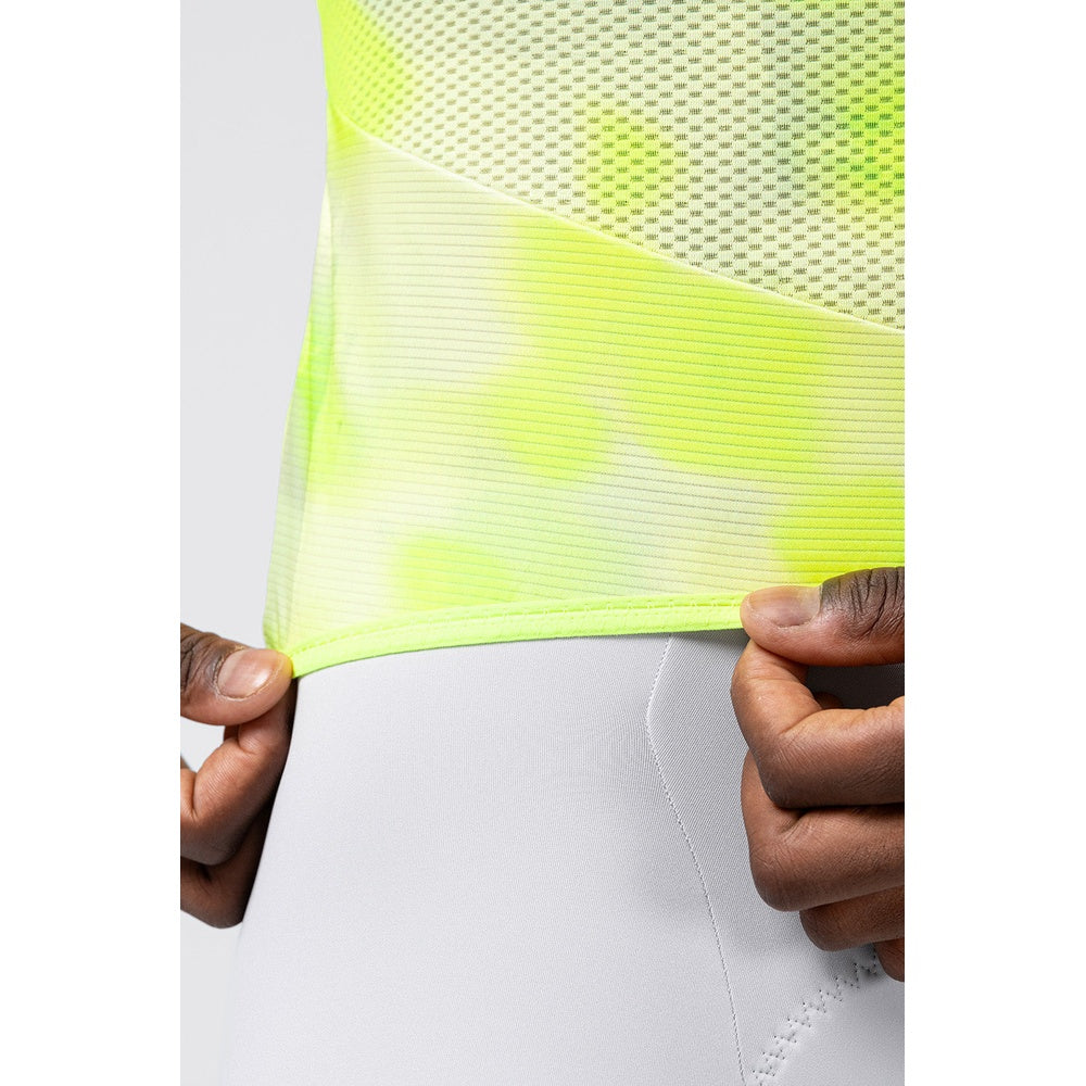 Close-up detail of Gobik Carrera 3.0 neon yellow jersey hem and mesh fabric texture