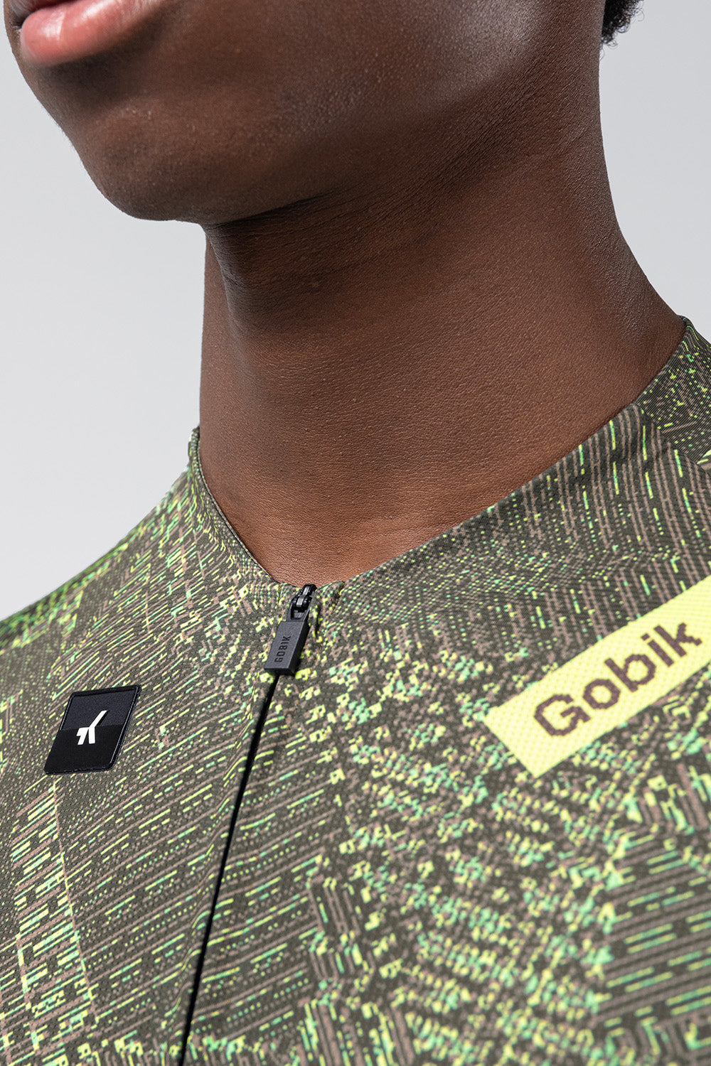 Gobik CX Pro cycling jersey in grid pattern with green digital camouflage design