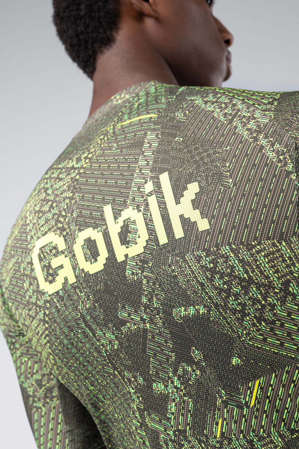 Gobik CX Pro cycling jersey with green digital circuit pattern on model