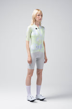 Woman wearing Gobik CX Pro cycling jersey in gray with neon green pattern