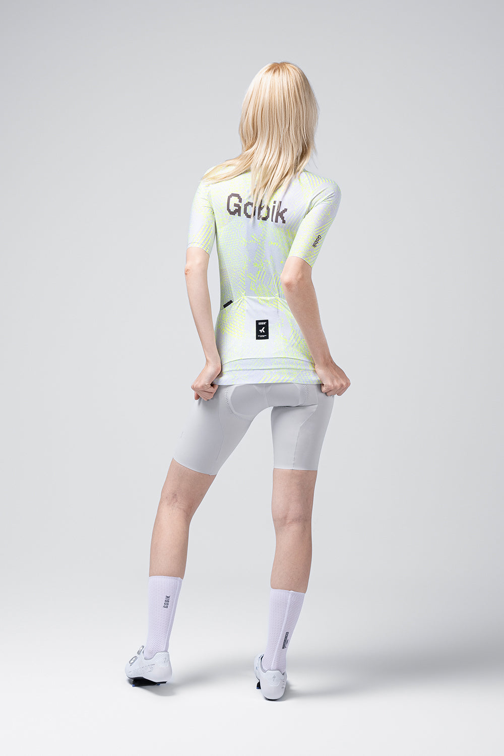 Gobik CX Pro 4.0 cycling jersey in Blast colorway, rear view on female model