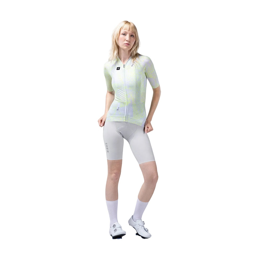 Female cyclist wearing Gobik CX Pro Jersey in Amazonian pattern with cycling shorts