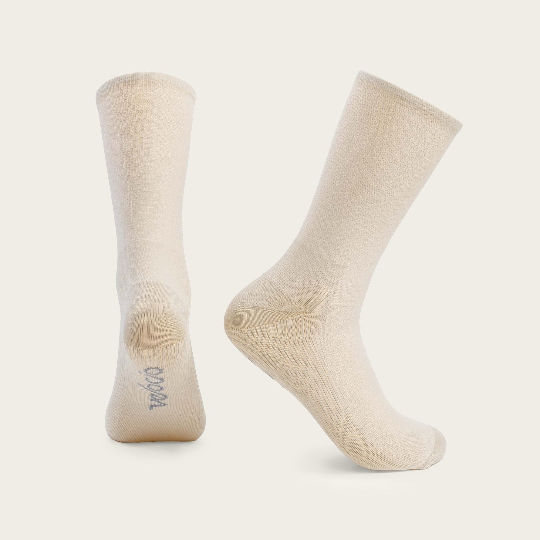 Velocio ultralight cycling socks in misty rose cream color on clean background