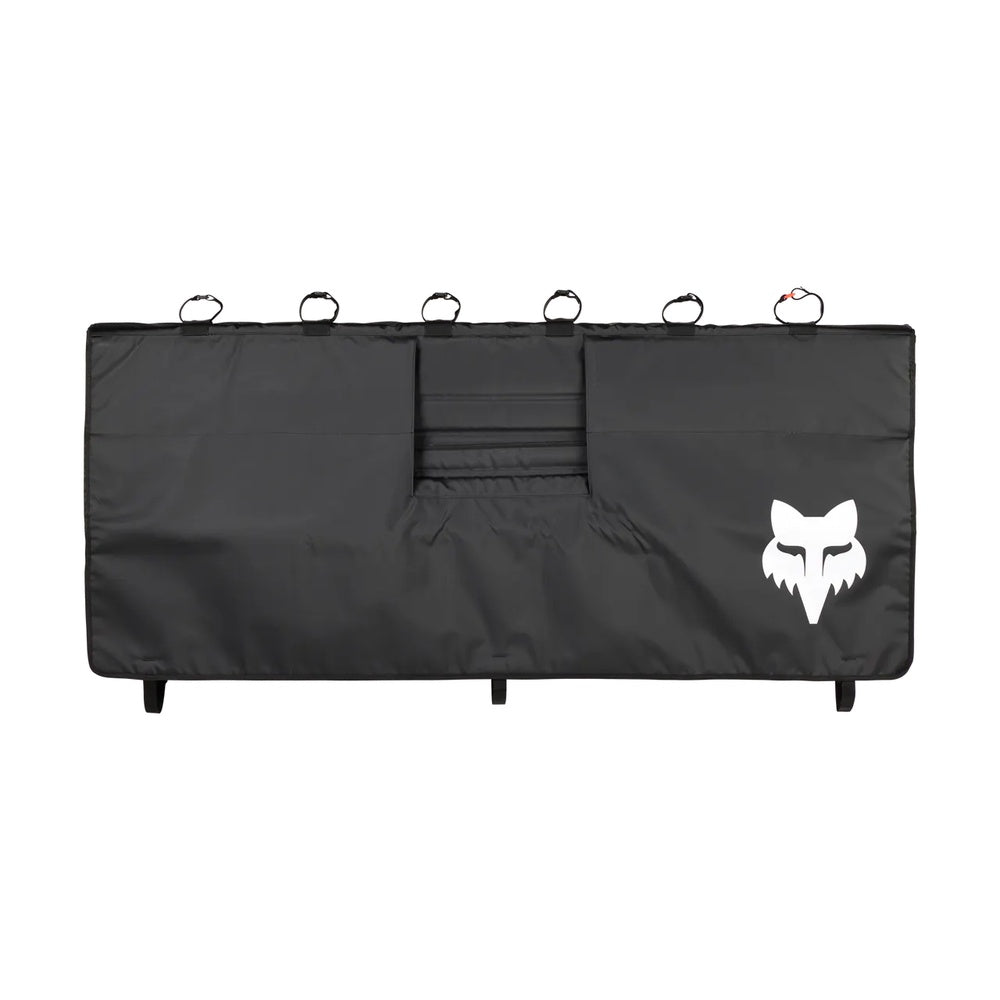 Fox Racing black tailgate cover with white fox head logo and tie-down straps