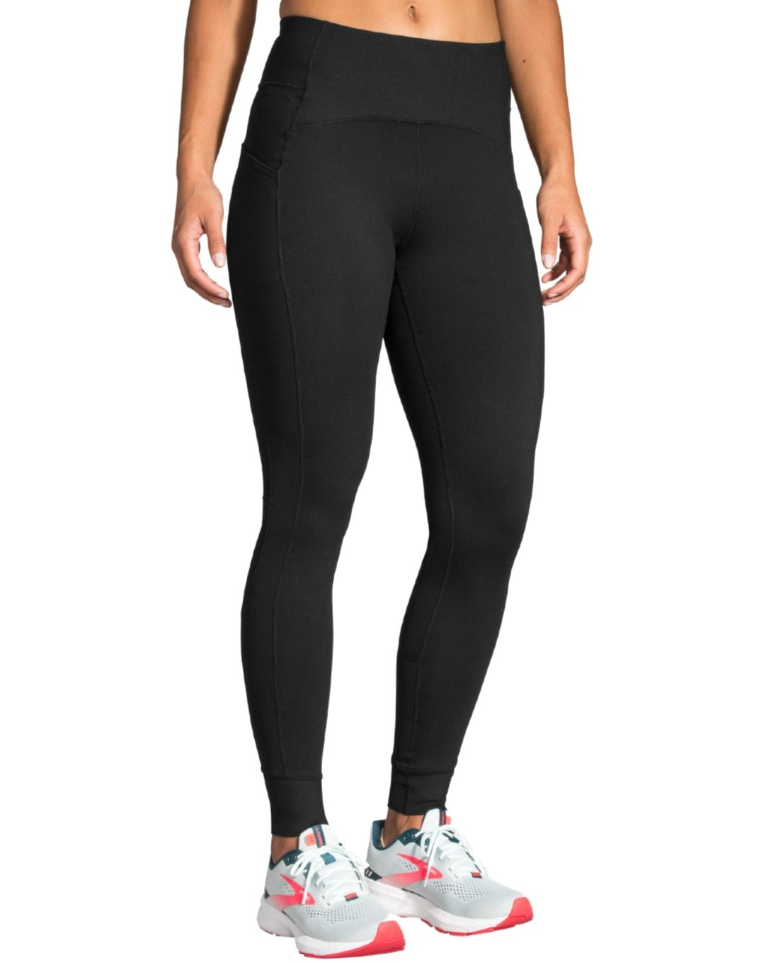 Woman wearing black Brooks Momentum Thermal Tights with high waistband and running shoes